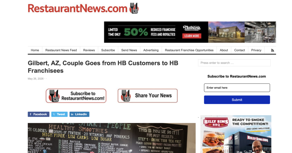 Website page showing restaurant news article with menu board chalkboard